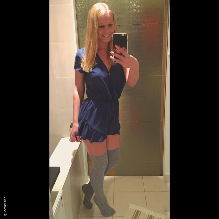 Blonde with tan lines teasing with her breasts