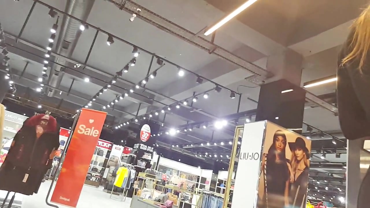 Video with sexy woman with big ass in tight pants in a public store