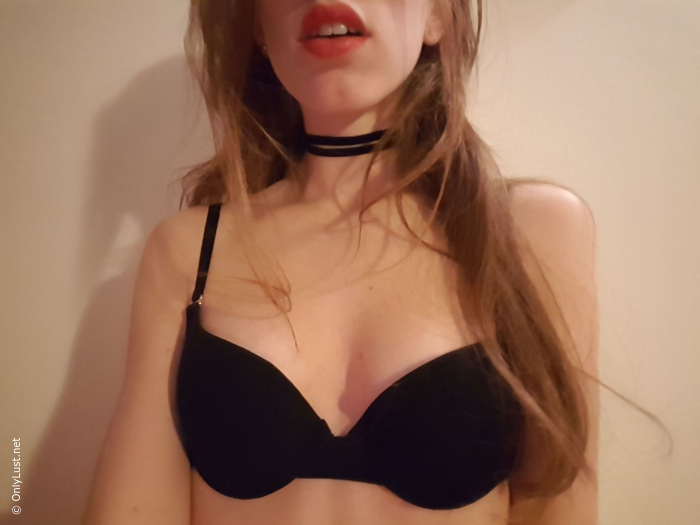 Slender and attractive girl takes selfie at home