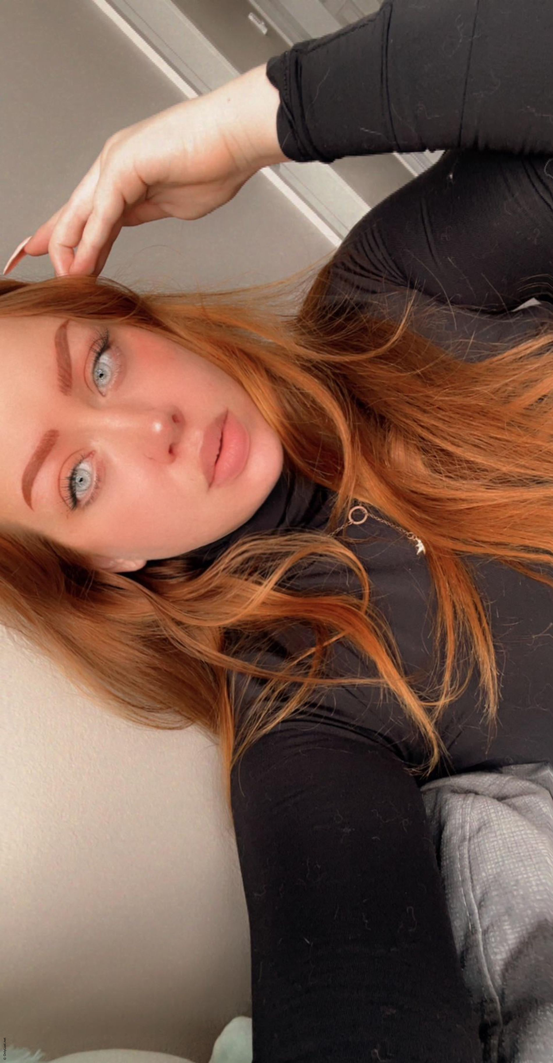 Takes selfies showing off her shaved pussy and her sexy breasts