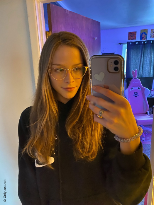 Slender girl takes selfies at home