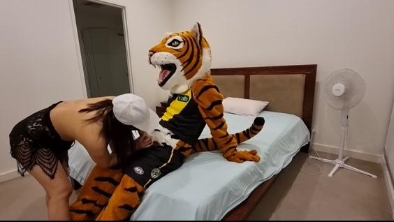 A girl fucks with a guy dressed in a Tiger Talisman