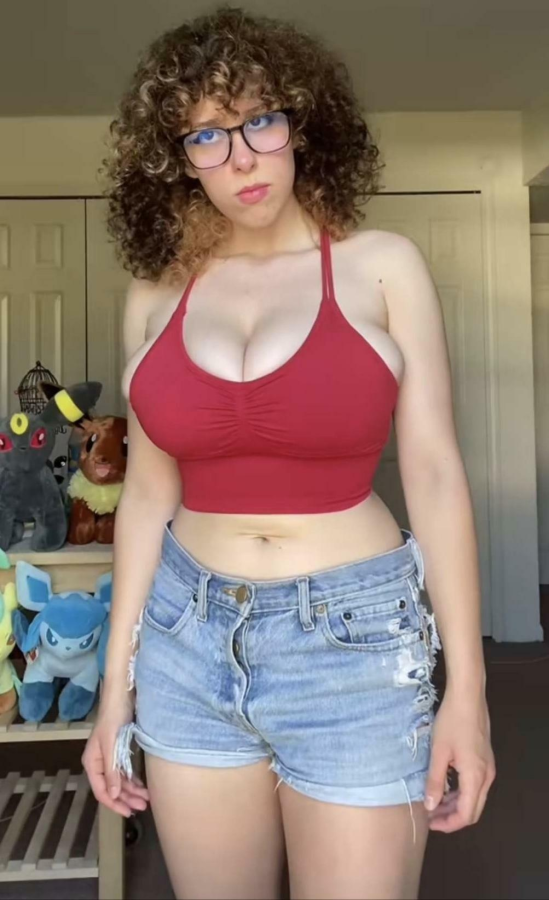 She is not happy to have her huge tits bursting out of her top