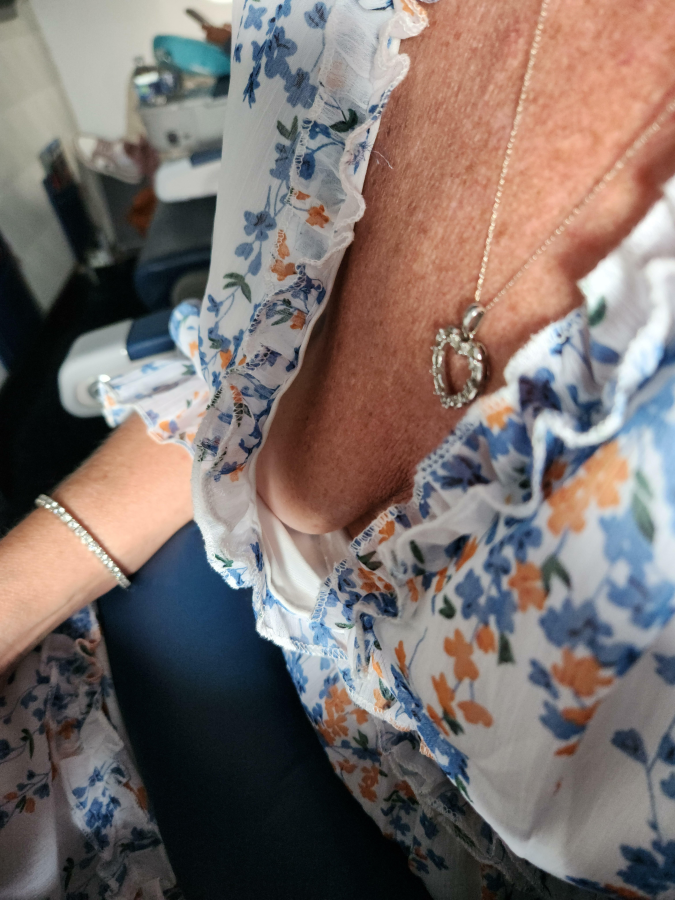 Heading out for vacation. Her dress on the plane (F52)