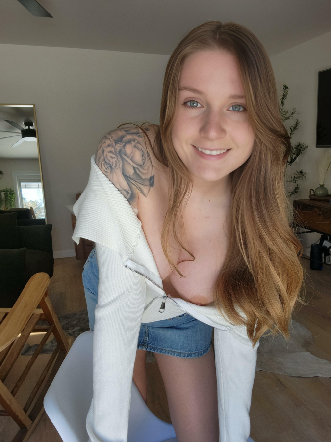 Smiling because you can see down my blouse