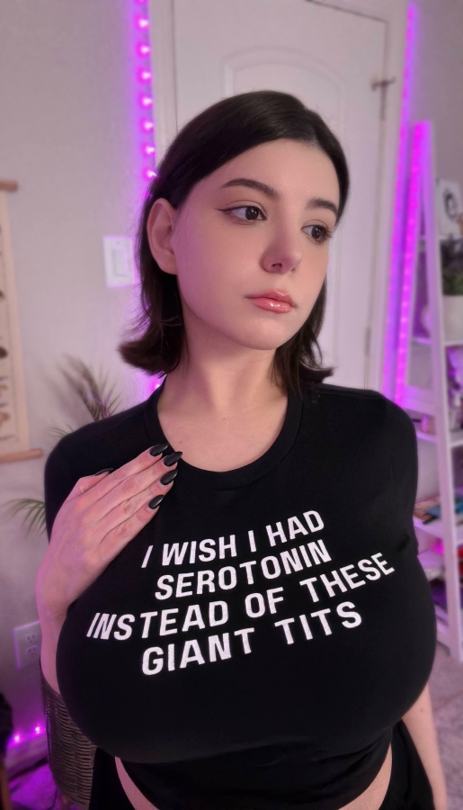 Busty mixed Asian woman showing off her large natural breasts and curvy figure